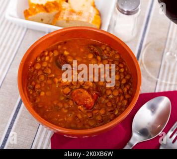 Stewed lentils with sausages, spanish Riojan lentils Stock Photo