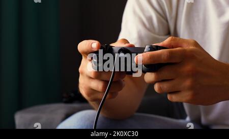 Man holding joystick in both hands Stock Photo