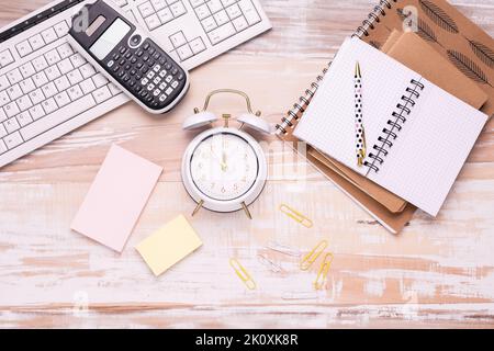 Concept of time management for office and school. Books, notepads with stickers Stock Photo
