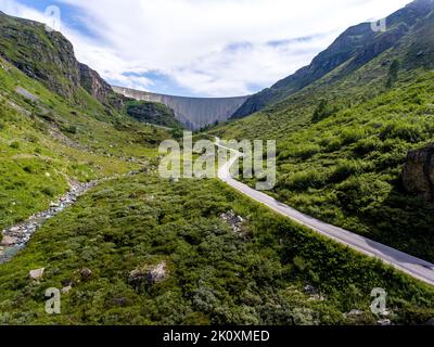 Landscape trough the Valley of Moiry and the Dam of the Moiry Lake under the Glacier of Moiry in Valais Swizer Stock Photo