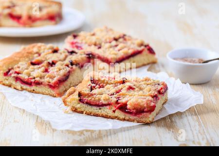 German plum cake (Zwetschgenkuchen) with  yeast dough and crumbles Stock Photo