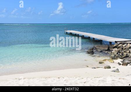 Beautiful turquoise waters and white sand beach on Rodgers Beach in Aruba. Stock Photo