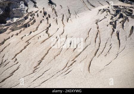 Mont Blanc massive. View from the aiguille du midi to Pointe Helbronner. Cable car over the glacier. cracking glaciers. Stock Photo