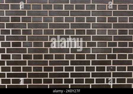 Black clinker brick wall background Stock Photo
