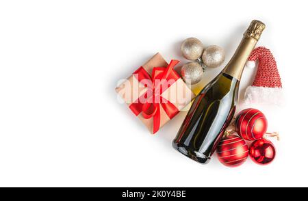 Champagne with gifts and toys on a white background. Christmas background. Stock Photo
