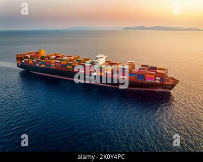 Aerial view of a large container cargo ship during sunset Stock Photo