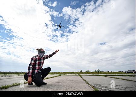 ZAPORIZHZHIA, UKRAINE - SEPTEMBER 8, 2022 - A man launches a UAV at the school of drone pilots organised by the volunteers of the Palianytsia Charity Stock Photo