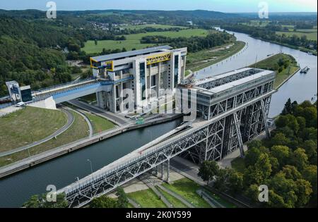 14 September 2022, Brandenburg, Niederfinow: The old (r) and the new (l) ship lift (aerial view with a drone). The dimensions of the new ship lift are enormous. The trough, in which the ships can travel up or down the approximately 36 meters in the elevator, weighs 9800 tons. After around 14 years of construction, the inauguration of the giant ship lift is now scheduled for October 4, 2022. The Federal Waterways and Shipping Administration has invested around 520 million euros in the new lift. The new facility will then be available for general shipping traffic from 05.10.2022. The old ship li Stock Photo