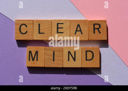 Clear Mind, words in wooden alphabet letters isolated on pink and purple background Stock Photo