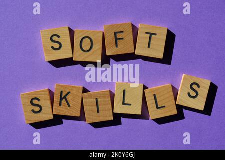 Soft Skills, words in wooden alphabet letters isolated on purple background Stock Photo