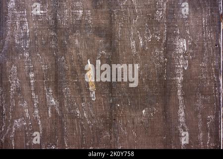 Brown plywood siding weathered with age. Stock Photo