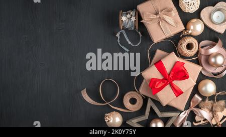 Christmas background with toys and gift boxes on a dark background. Stock Photo