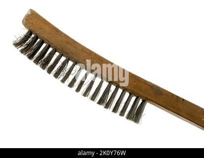 Old wood handle wire brush with bent wires and stained handle on a white background. Stock Photo