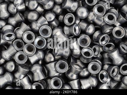 Top close view of air gun pellets illuminated with natural light. Stock Photo