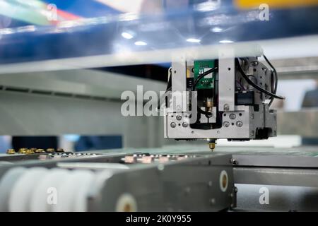 Automatic SMD pick and place machine assembling computer circuit board Stock Photo
