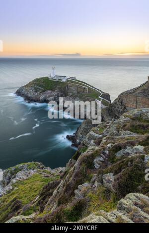 South Stack Lighthouse (Ynys Lawd) is located near Holyhead and Anglesey Island in the north of Wales Stock Photo