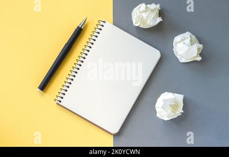 Open blank notepad, pen and crumpled paper on office desk. Education or business concept background Stock Photo