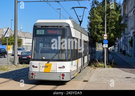 Antwerp, Belgium - August 2022: Electric tram running on a street near the city centre. The city has an extensive network of trams. Stock Photo