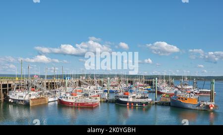 Fishing boats tied up at the wharf in Digby Nova Scotia on a summer evening. Stock Photo