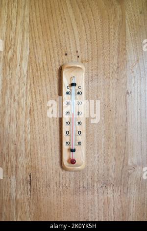 https://l450v.alamy.com/450v/2k0yk5h/mercury-thermometer-for-determining-the-temperature-in-the-room-hanging-on-a-wooden-rack-isolated-2k0yk5h.jpg