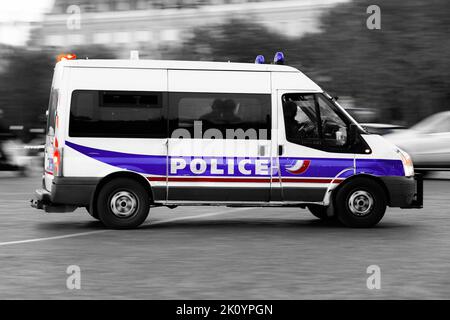 A police car (truck, van) drives through the city ensuring security in Paris, France on July 24, 2022. French national police in action. Stock Photo