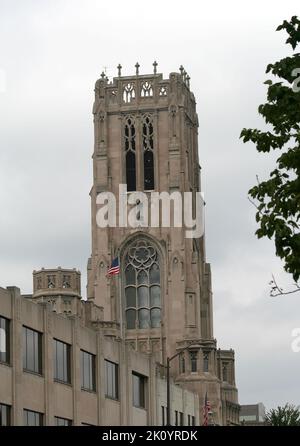 INDIANAPOLIS,INDIANA,USA-OCTOBER 18:Tower of The Scottish Rite Cathedral with US Flags. October 18,2006 in Indianapolis, Indiana, USA Stock Photo