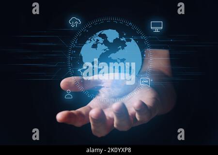 Globalization and the global network of the Internet with a world map and icons like a hologram on the hands. Stock Photo
