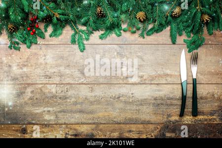 Authentic Christmas Table Setting. Christmas menu mockup. Christmas, New Year table place setting. Christmas or New Year invitation card on dark woode Stock Photo