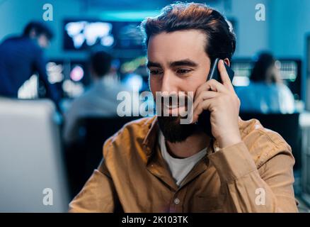 Young business male stock trader working at office Stock Photo