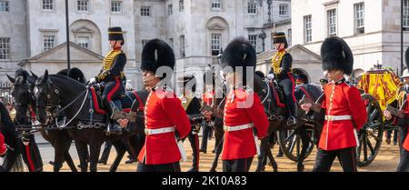 London, UK. 14th Sep, 2022. Coldstream Guards accompany the coffin of Britain's Queen Elizabeth as it is transported from Buckingham Palace to the Houses of Parliament for her lying in state, in London, Britain, September 14, 2022. Credit: Rob Taggart/Alamy Live News Credit: Rob Taggart/Alamy Live News Stock Photo