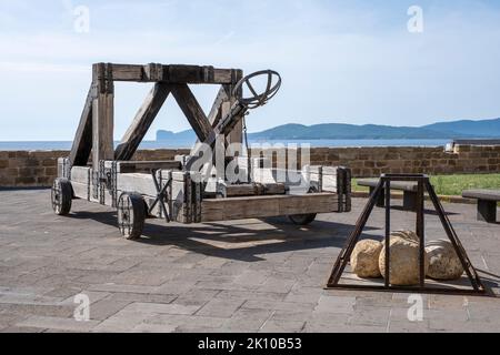Ancient catapult on the ramparts of the old town of Alghero, Sardinia, Italy Stock Photo