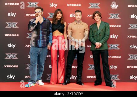 MILAN, ITALY - SEP 13, 2022 : Dargen D’Amico, Ambra Angiolini, Fedez and Rkomi attend the press conference of X Factor Italy 2022 at Area Pergolesi in