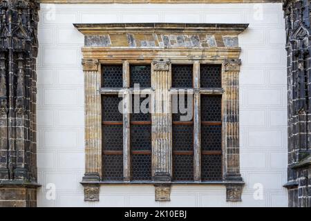 Rectangular window with a small lattice on the background of a light wall. From the Window of the World series. Stock Photo