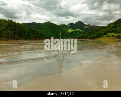 Photography of the flooded Church at Geamana near Rosia Montana, Romania. Photo was taken from a drone at lower altitude, close to the churches tower. Stock Photo