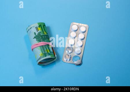 Medical business or prices concept. Making money in pharmaceutical industry or high medical expenses, drug dealing, Pills Stock Photo