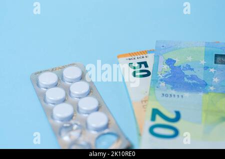 Medical business or prices concept. Making money in pharmaceutical industry or high medical expenses, drug dealing, Pills Stock Photo