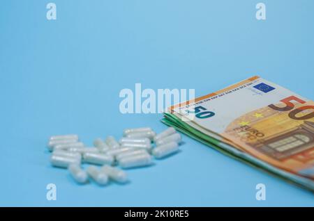 Medical business or prices concept. Making money in pharmaceutical industry or high medical expenses, drug dealing, Pills Stock Photo