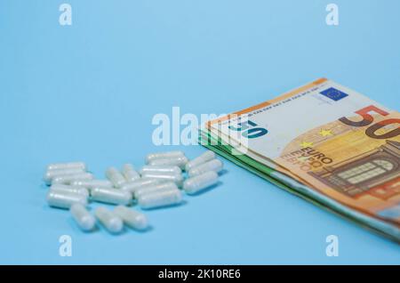 Medical business or prices concept. Making money in pharmaceutical industry or high medical expenses, drug dealing, Pills Stock Photo
