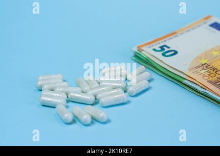 Medical business or prices concept. Making money in pharmaceutical industry or high medical expenses, drug dealing, Pills Stock Photo