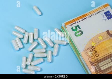 Medical business or prices concept. Making money in pharmaceutical industry or high medical expenses, drug dealing, Pills Stock Photo