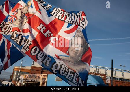 Glasgow, Scotland, 14 September 2022 Flags depicting Her Majesty Queen Elizabeth II who has died aged 96yrs, on sale near Rangers FC’s Ibrox Stadium, in Glasgow, Scotland, 14 September 2022. Photo credit: Jeremy Sutton-Hibbert/Alamy Live News. Stock Photo