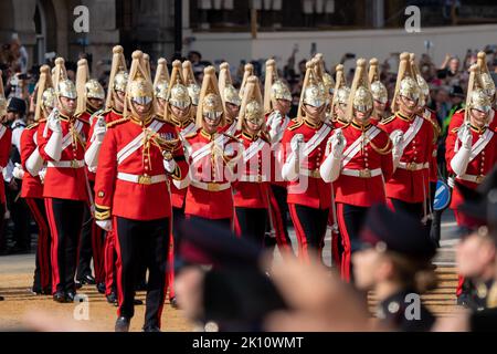 Members of the Household Cavalry march with swords reversed out of respect follow the Queen's coffin procession followed by King Charles III and immediate Royal family at Whitehall, London, United Kingdom, 14th September 2022  (Photo by Richard Washbrooke/News Images) Stock Photo