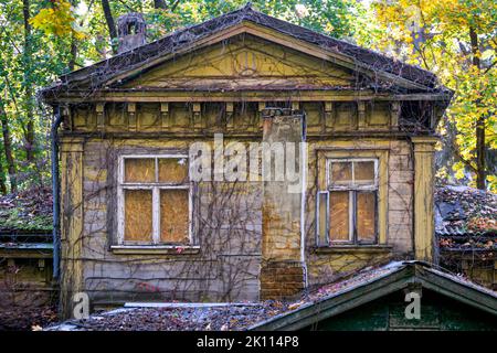 Boarded up and abandoned old house made of boards. Stock Photo