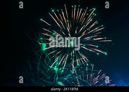 An explosion of bright single fireworks, against the background of the night sky. High quality photo Stock Photo