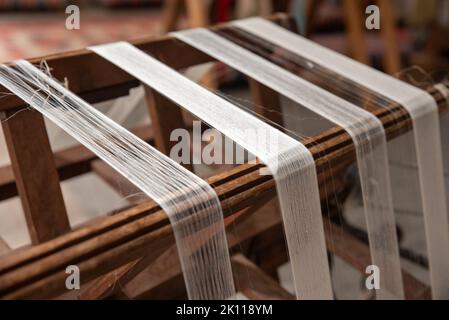 cocoons of white silkworms bred to produce silk , raw silk Stock Photo