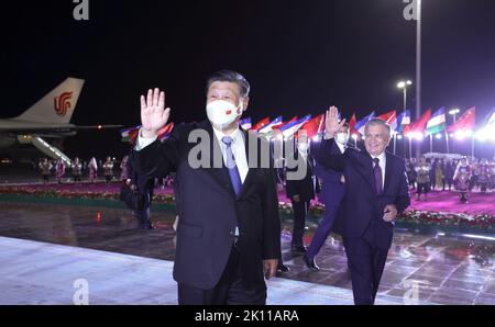 Samarkand. 14th Sep, 2022. Chinese President Xi Jinping arrives in Samarkand to pay a state visit to Uzbekistan and attend the 22nd meeting of the Council of Heads of State of the Shanghai Cooperation Organization (SCO), Sept. 14, 2022. At the airport, Xi was warmly greeted by Uzbek President Shavkat Mirziyoyev, Prime Minister Abdulla Aripov, Foreign Minister Vladimir Norov, Governor of Samarkand region Erkinjon Turdimov and other high-level officials. Credit: Ju Peng/Xinhua/Alamy Live News Stock Photo