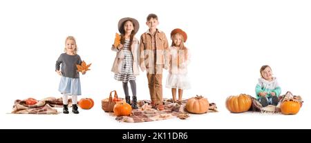 Set of cute little children in autumn clothes and with pumpkins isolated on white Stock Photo