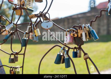 Lockers of love in Bardejov city, Slovakia. Near singing fountain is big metal heart where people can lock their love with lockers. Stock Photo