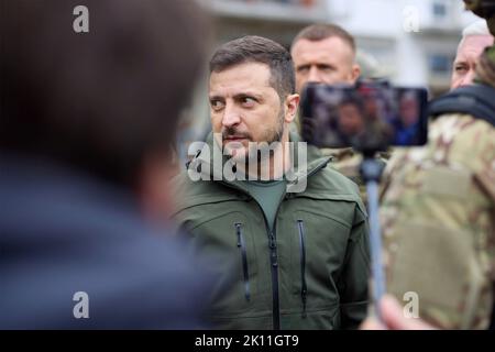 Izium, Ukraine. 14th Sep, 2022. Ukrainian President Volodymyr Zelenskyy, speaks with residents and views destruction during a visit to the recaptured region, September 14, 2022 in Izium, Kharkiv region, Ukraine. Zelensky made a surprise visit to the city recaptured from Russia during a Ukrainian counteroffensive. Credit: Ukrainian Presidential Press Office/Ukraine Presidency/Alamy Live News Stock Photo