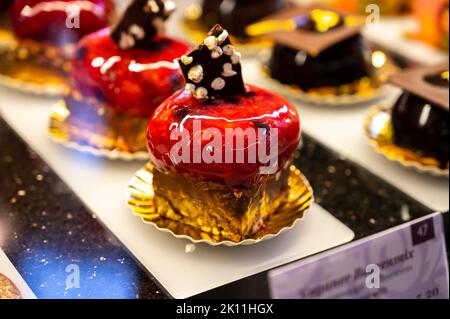 Austrian desserts, different types of chocolate and fruit cakes on display in cafe in Vienna. Stock Photo